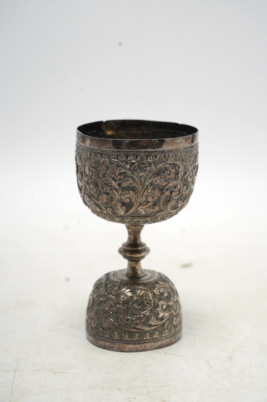 An Indian white metal double measure, 97mm, 87 grams. Condition - fair